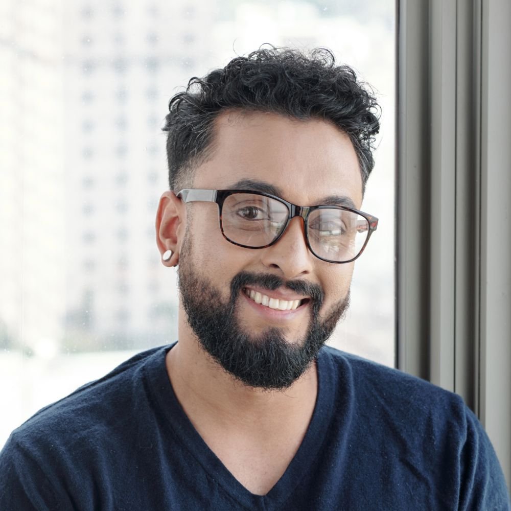 handsome smiling man in glasses 5YVEYDZ 1 1